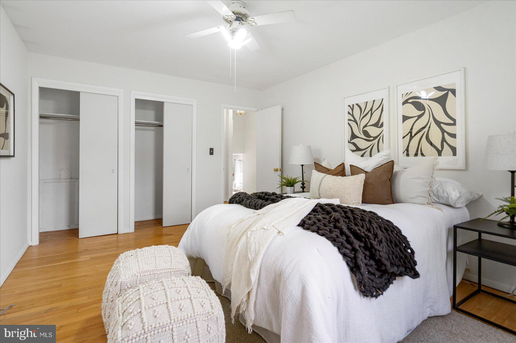 1828 Wycliffe Road Baltimore, MD 21234 - Photo 25 of 41 a bedroom with a bed and a chandelier