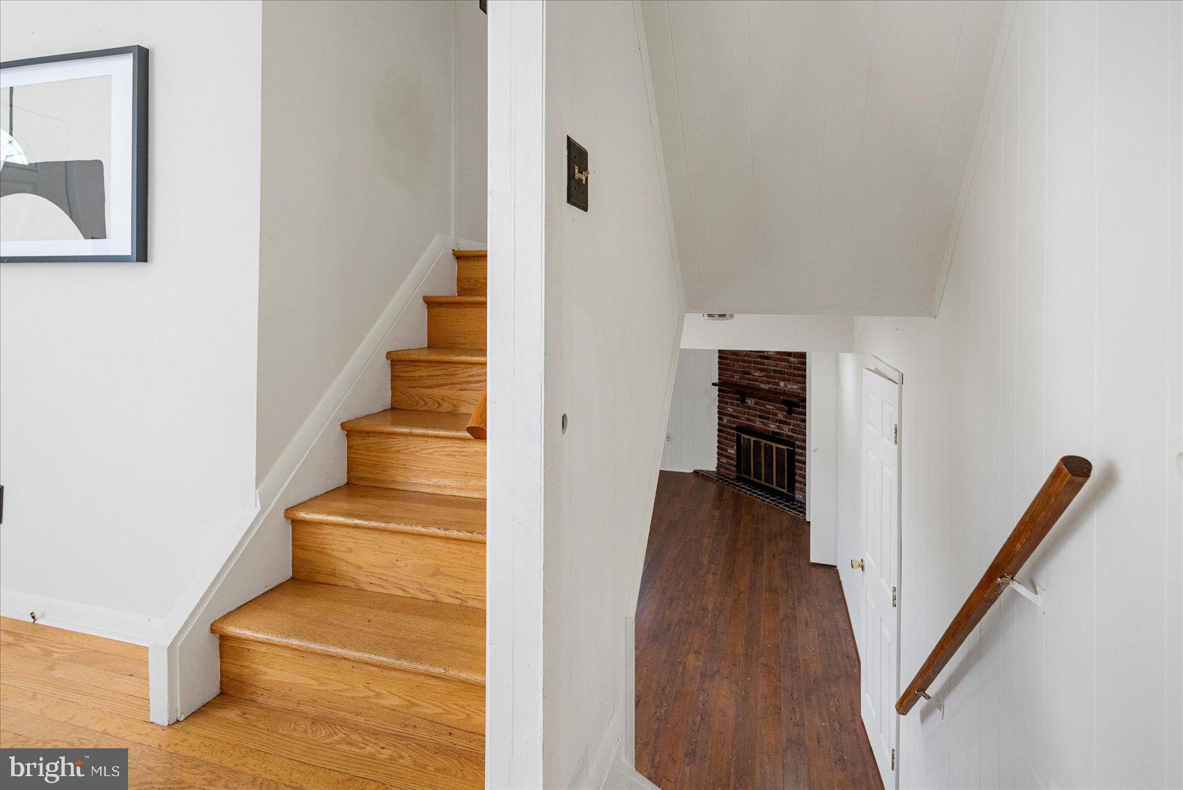 1828 Wycliffe Road Baltimore, MD 21234 - Photo 26 of 41 a view of a hallway with wooden floor and staircase