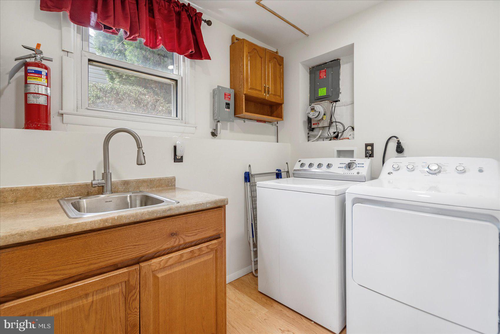 1828 Wycliffe Road Baltimore, MD 21234 - Photo 31 of 41 a utility room with sink dryer and washer
