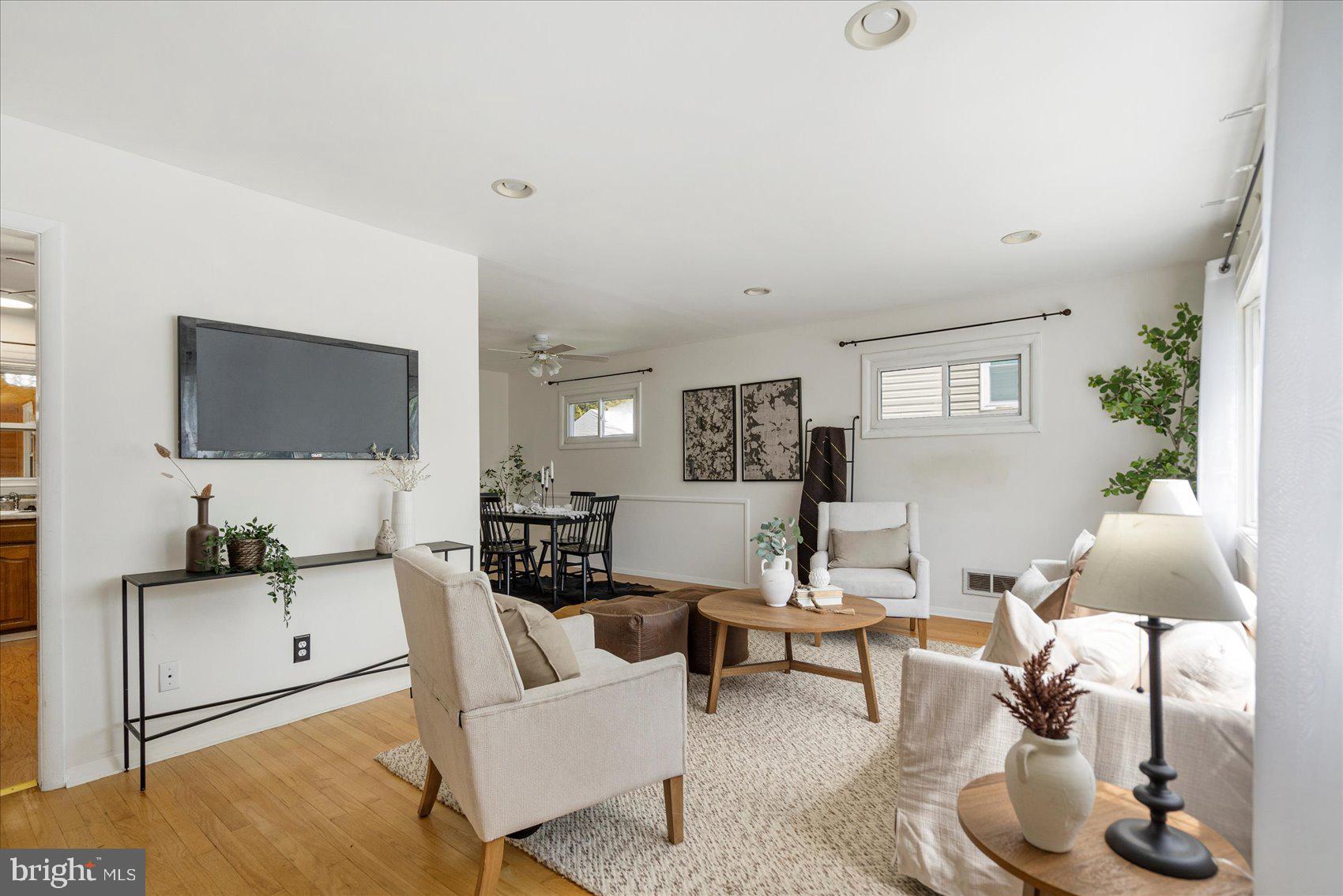 1828 Wycliffe Road Baltimore, MD 21234 - Photo 4 of 41 a living room with furniture a lamp and a flat screen tv