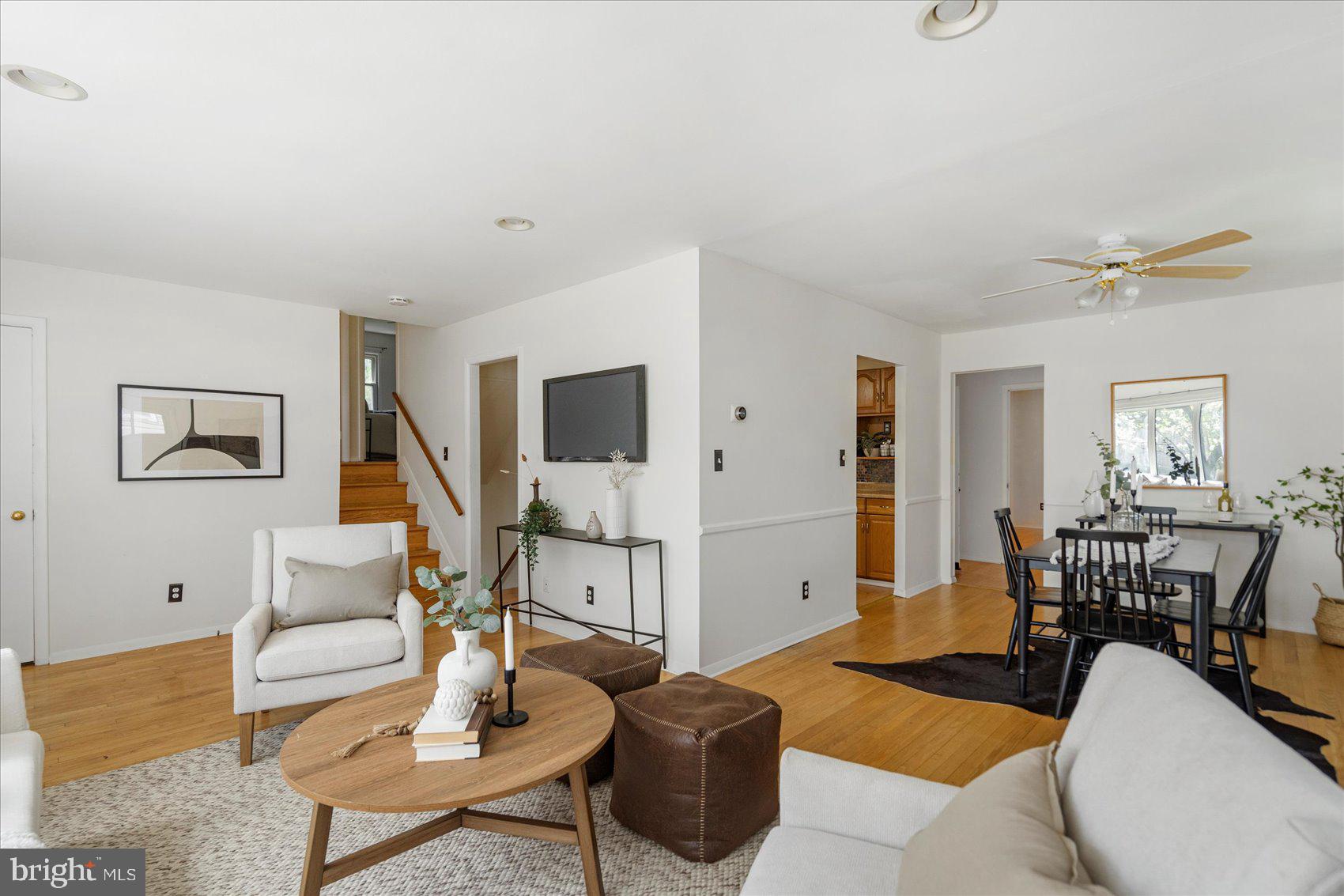 1828 Wycliffe Road Baltimore, MD 21234 - Photo 6 of 41 a living room with furniture a flat screen tv and a table