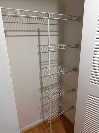 a view of a room with racks on the wall