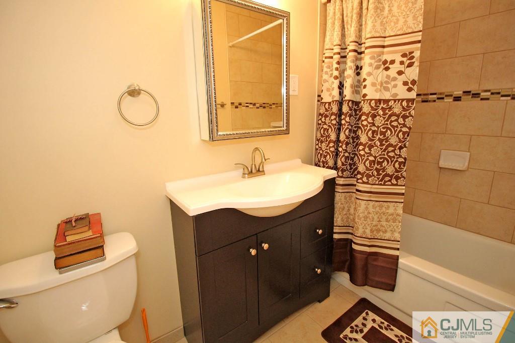 5 Ashley Road Edison, NJ 08817 - Photo 17 of 25 a bathroom with a sink toilet and shower