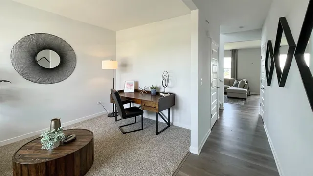 a view of a livingroom with furniture and hardwood floor