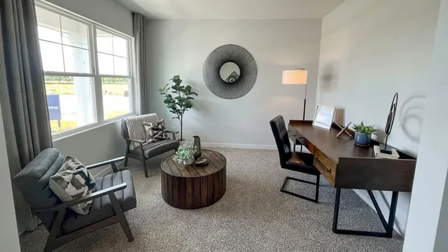 a view of a dining room with furniture and window