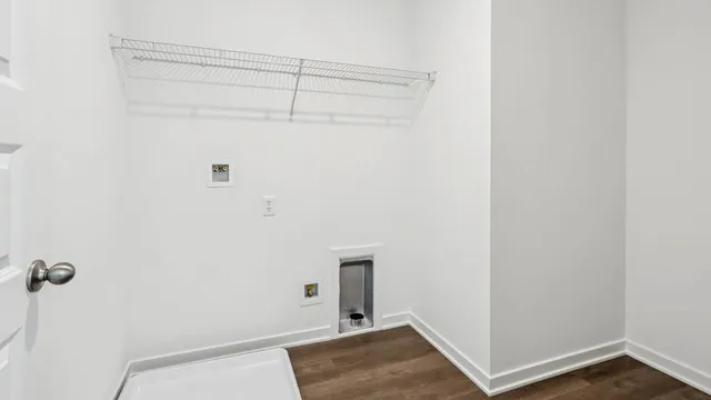 a view of walk in closet with clothes