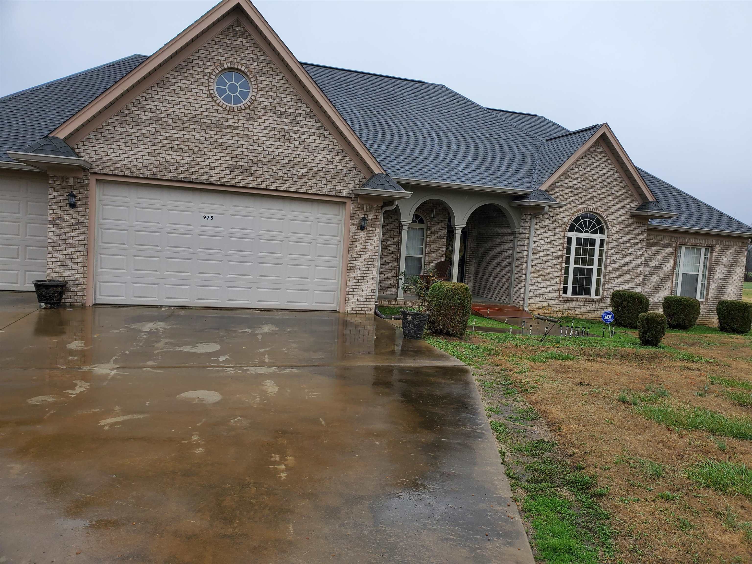 975 Maxwell Road Bolivar, TN 38008 - Photo 1 of 1 a front view of a house with a yard