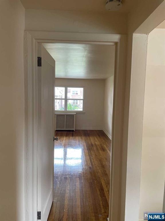 29 West Passaic Street Maywood, NJ 07607 - Photo 18 of 28 a view of empty room with wooden floor and fan