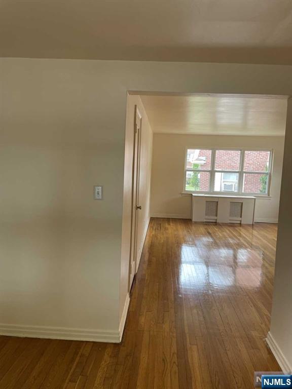 29 West Passaic Street Maywood, NJ 07607 - Photo 20 of 28 wooden floor in an empty room with a window