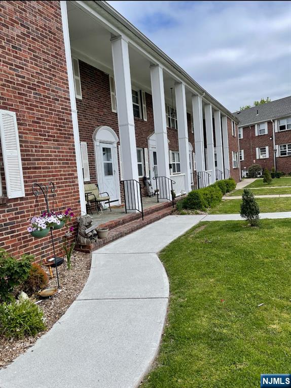 29 West Passaic Street Maywood, NJ 07607 - Photo 24 of 28 a front view of a house with garden