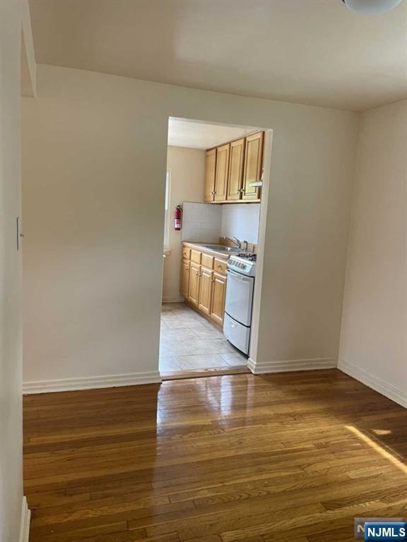29 West Passaic Street Maywood, NJ 07607 - Photo 6 of 28 a view of a kitchen with wooden floor