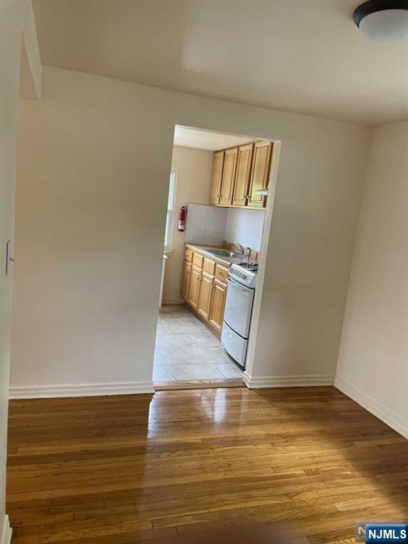 29 West Passaic Street Maywood, NJ 07607 - Photo 8 of 28 a view of a room with wooden floor and cabinet