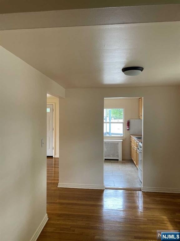 29 West Passaic Street Maywood, NJ 07607 - Photo 10 of 28 a view of empty room with wooden floor and fan