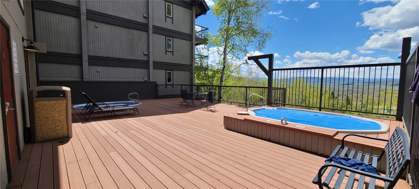 2590 Longthong Road, Unit 211 Steamboat Springs, CO 80487 - Photo 21 of 26 View of pool with a wooden deck and outdoor dining area