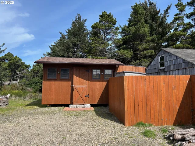 a backyard of a house with a tree