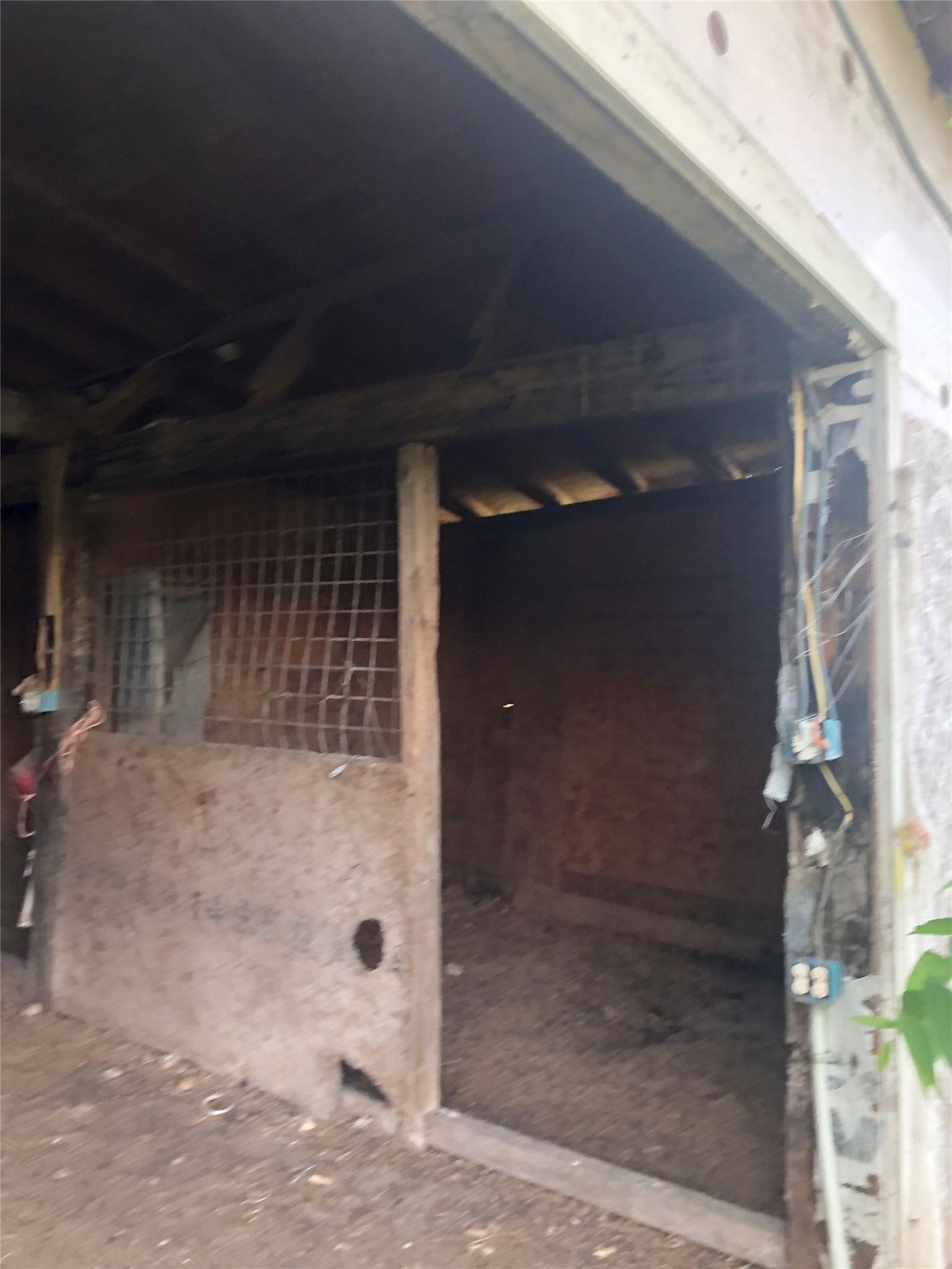 13414 Elm Grove Road Buda, TX 78610 - Photo 6 of 13 A well-ventilated stable stall awaits its next equine resident.