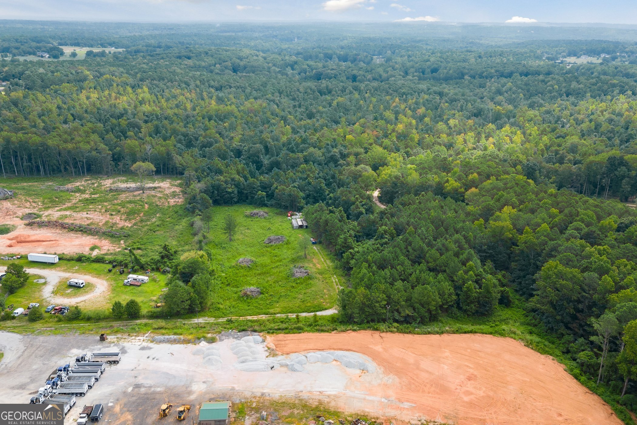 166 Highway Villa Rica, GA 30180 - Photo 7 of 8 a view of a garden with a lake