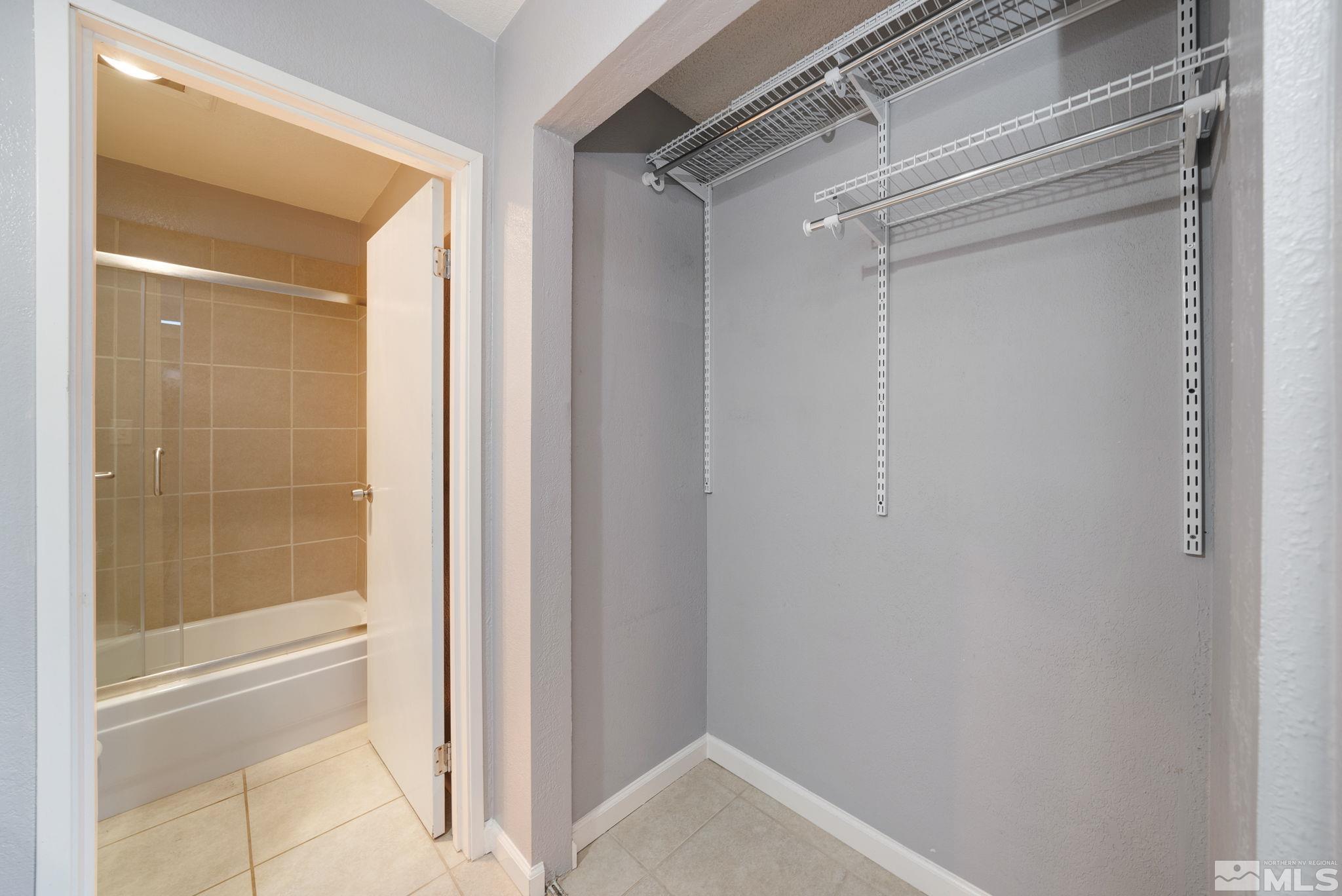 2450 Lymbery Street, Unit 227 Reno, NV 89509 - Photo 9 of 14 a bathroom with a glass shower door