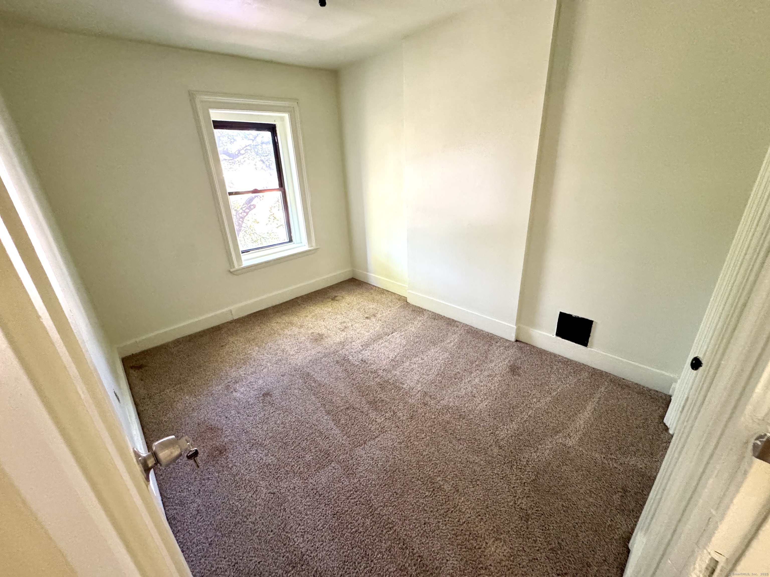 491 Meadow Street Waterbury, CT 06702 - Photo 11 of 12 an empty room with windows