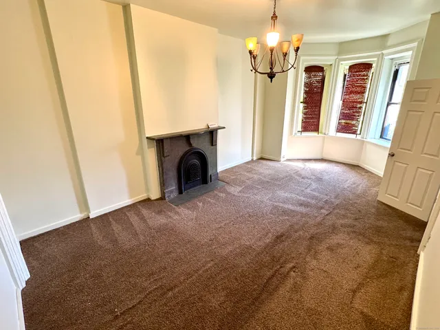 a view of an empty room with windows