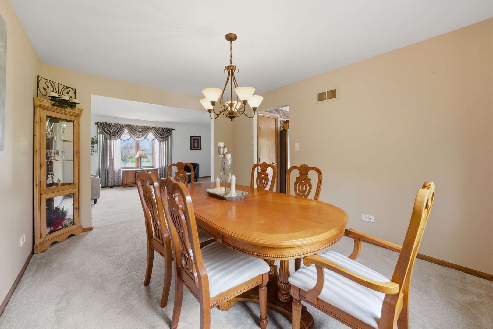 3552 Fairway Drive Crete, IL 60417 - Photo 5 of 27 a view of a dining room with furniture and a chandelier