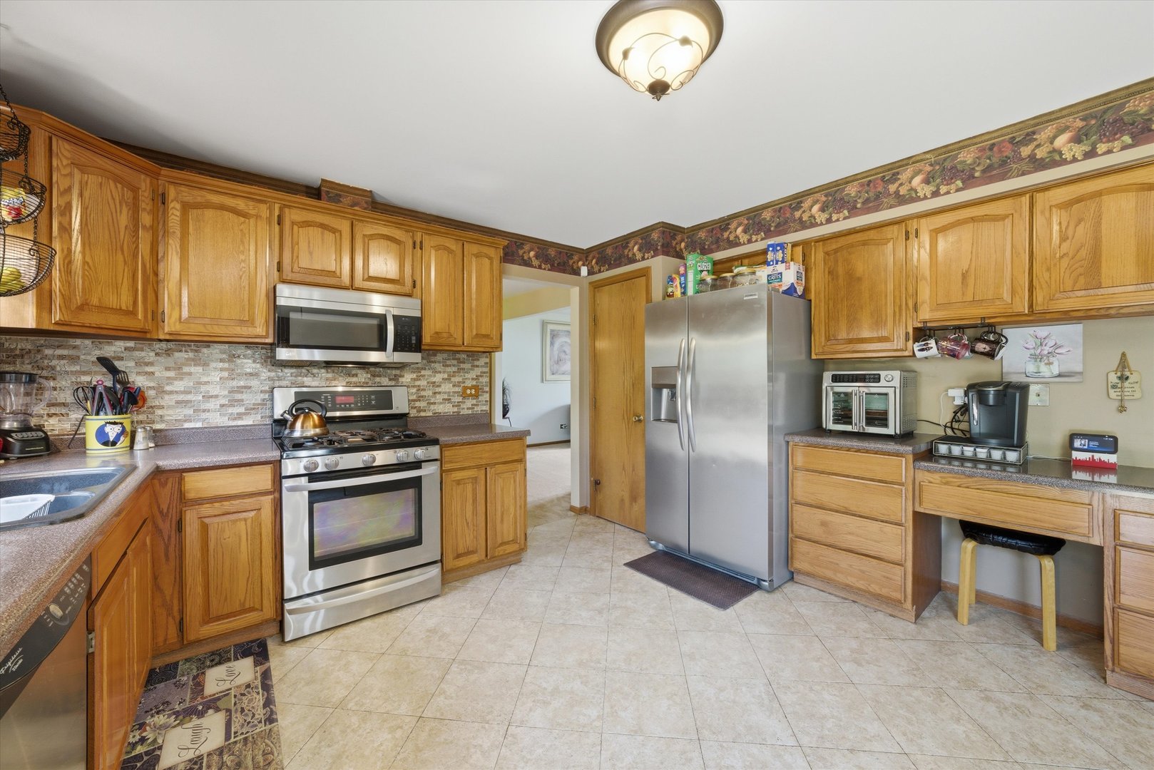 3552 Fairway Drive Crete, IL 60417 - Photo 6 of 27 a kitchen with stainless steel appliances granite countertop a refrigerator a stove top oven a sink and dishwasher