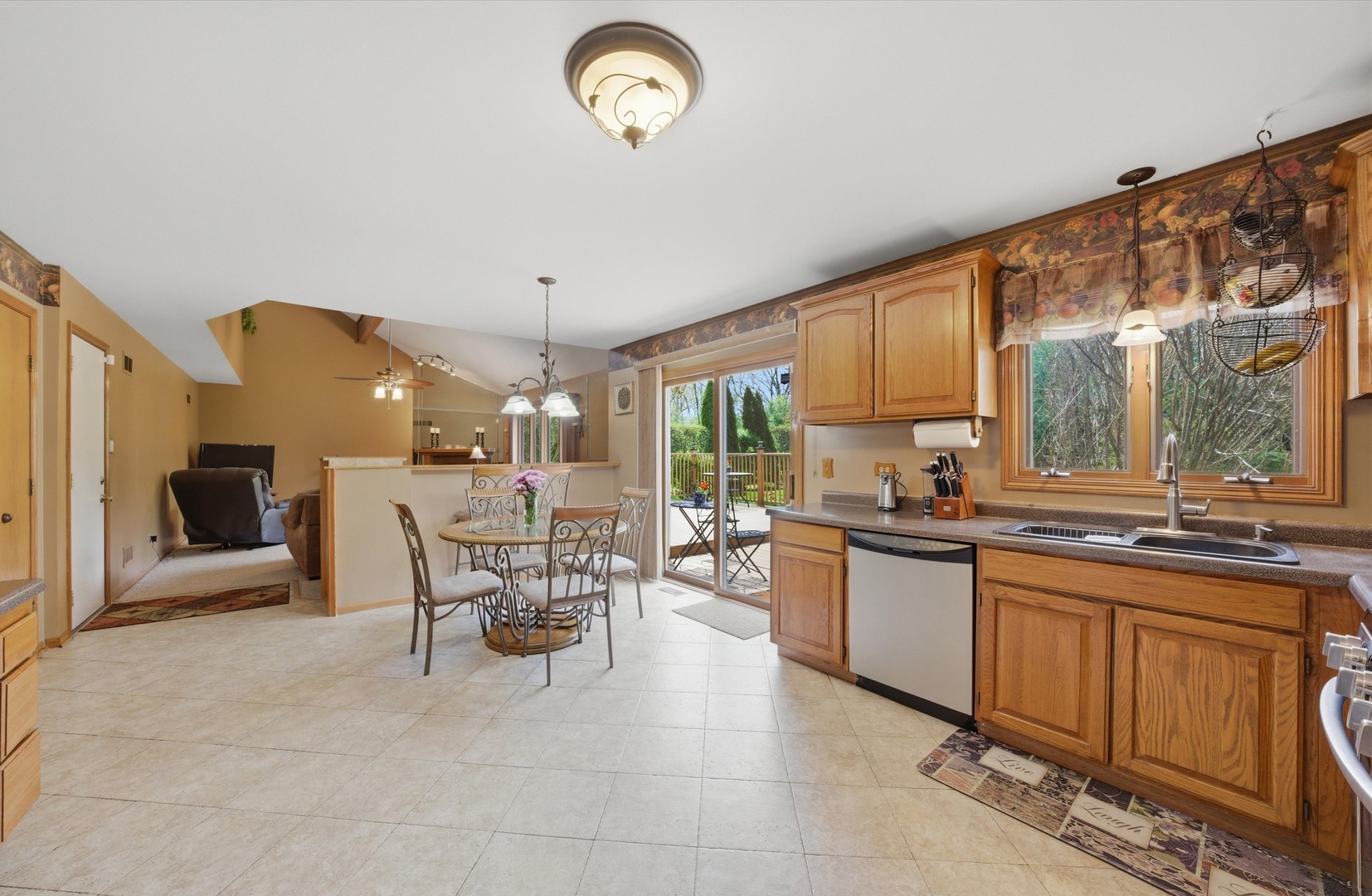 3552 Fairway Drive Crete, IL 60417 - Photo 7 of 27 a dining hall with stainless steel appliances granite countertop a stove and a sink with couches chair