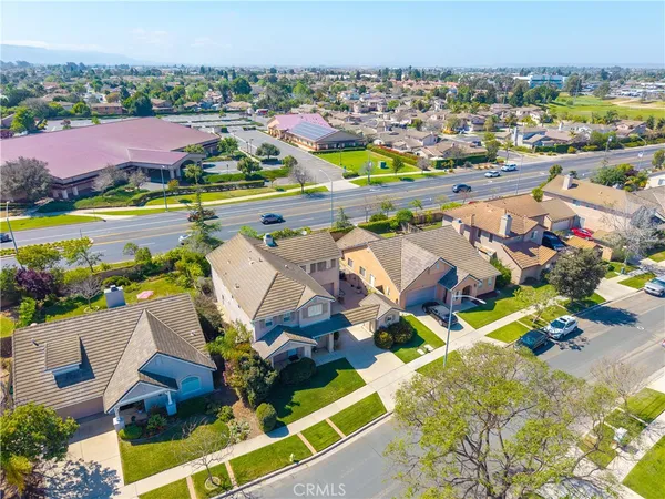 an aerial view of residential houses with outdoor space and river view