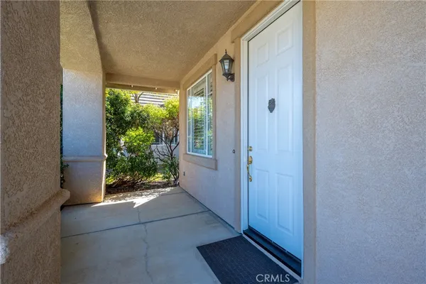 a view of an entryway with garden
