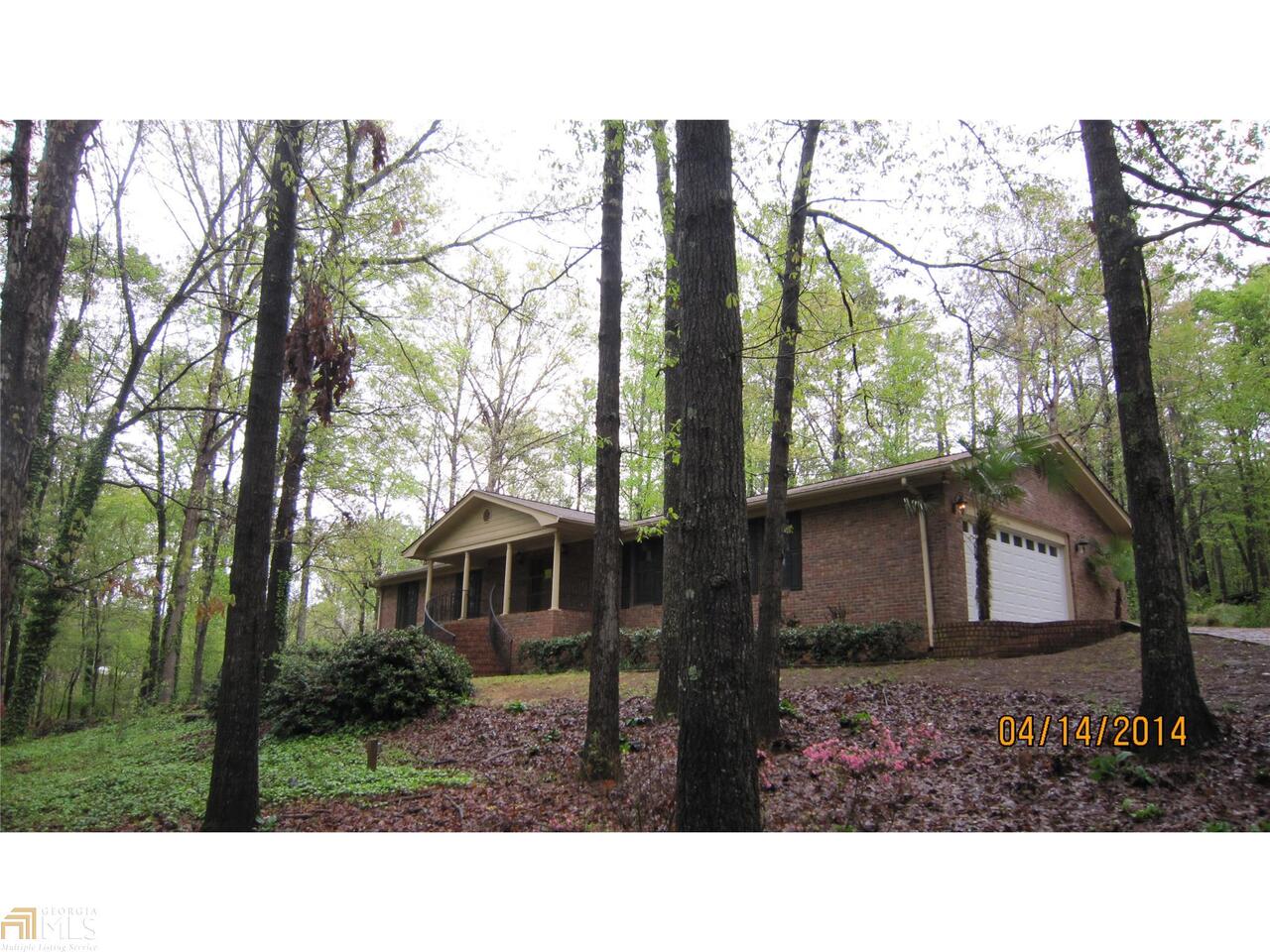 5654 Stagecoach Road Rex, GA 30273 - Photo 1 of 1 a black and white photo of a house