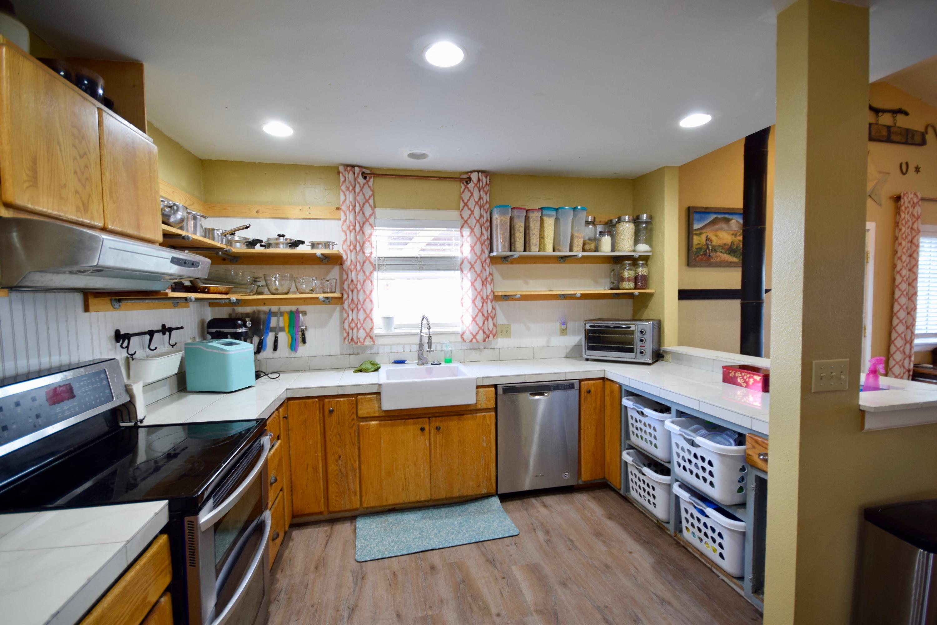 22169 Nelson Road Bend, OR 97701 - Photo 15 of 42 a kitchen with a sink stove and cabinets