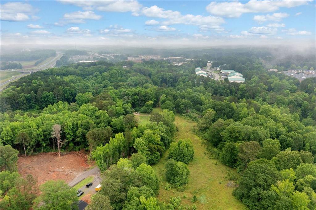 643 North Rope Mill Road Woodstock, GA 30188 - Photo 4 of 7 a view of a bunch of trees in a yard