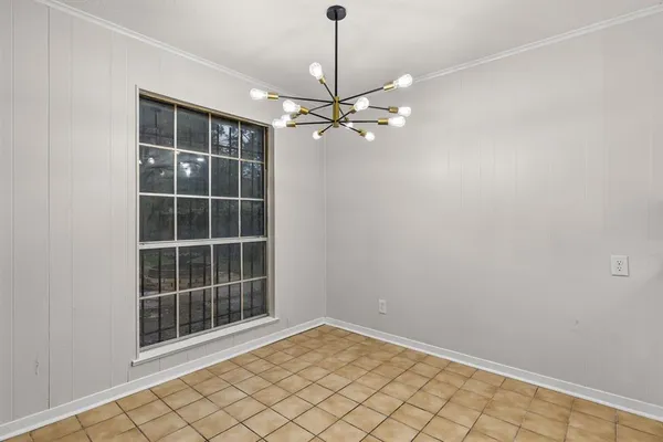 a kitchen with granite countertop a sink a stove and cabinets