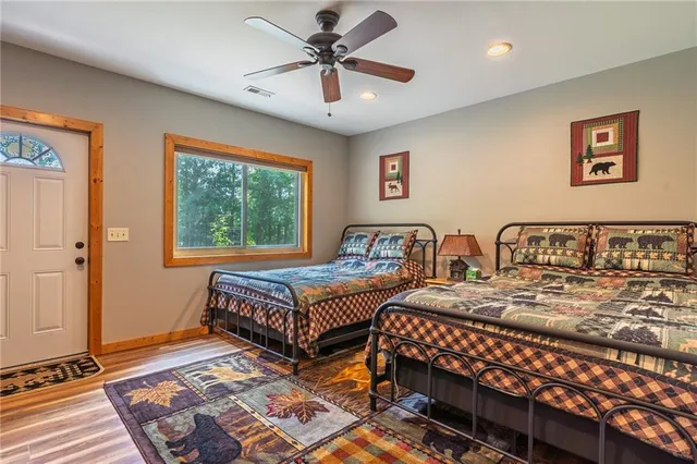 a bedroom with two beds and a window