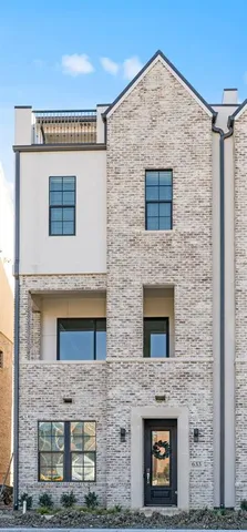 a brick building with a door and windows