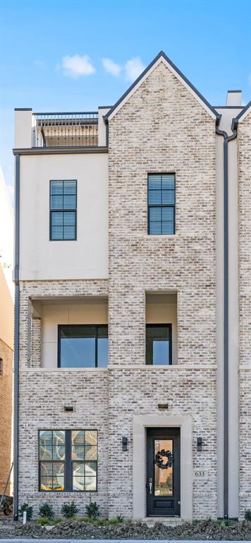 a brick building with a door and windows