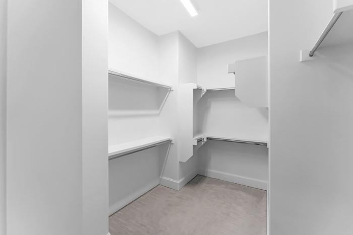 633 Dalton Lane Irving, TX 75039 - Photo 16 of 26 a view of an empty walk in closet