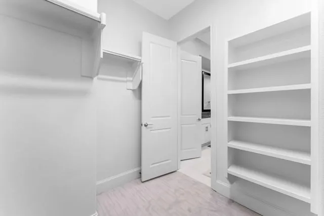 a view of an empty walk in closet