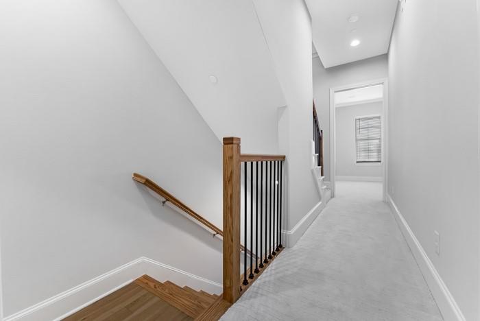 633 Dalton Lane Irving, TX 75039 - Photo 23 of 26 a view of a hallway with wooden floor and entryway