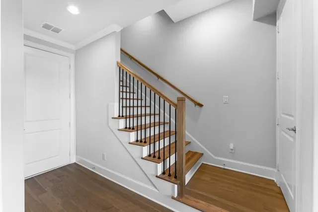 an entryway in a hall with wooden floor