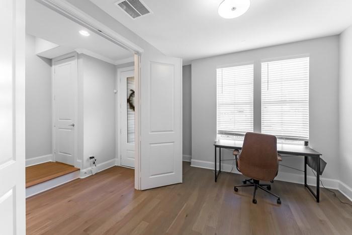 633 Dalton Lane Irving, TX 75039 - Photo 8 of 26 a view of a workspace with furniture and a window