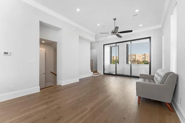 a view of an livingroom with furniture and wooden floor
