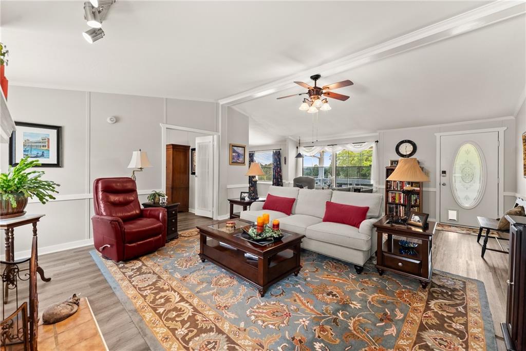 1689 Old State Road Pendergrass, GA 30567 - Photo 12 of 58 a living room with furniture flowerpot and a chandelier