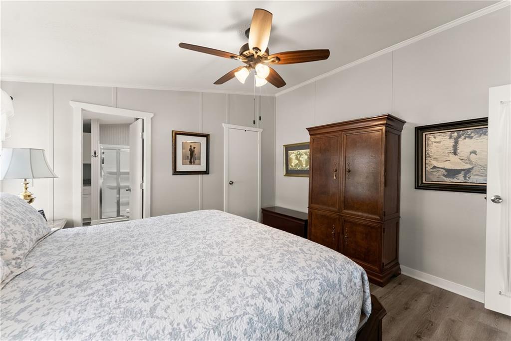 1689 Old State Road Pendergrass, GA 30567 - Photo 15 of 58 a bedroom with a bed and a refrigerator