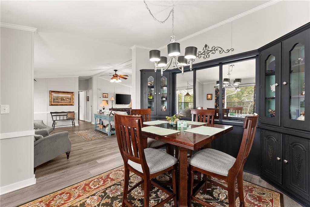 1689 Old State Road Pendergrass, GA 30567 - Photo 25 of 58 a view of a dining room with furniture window and wooden floor