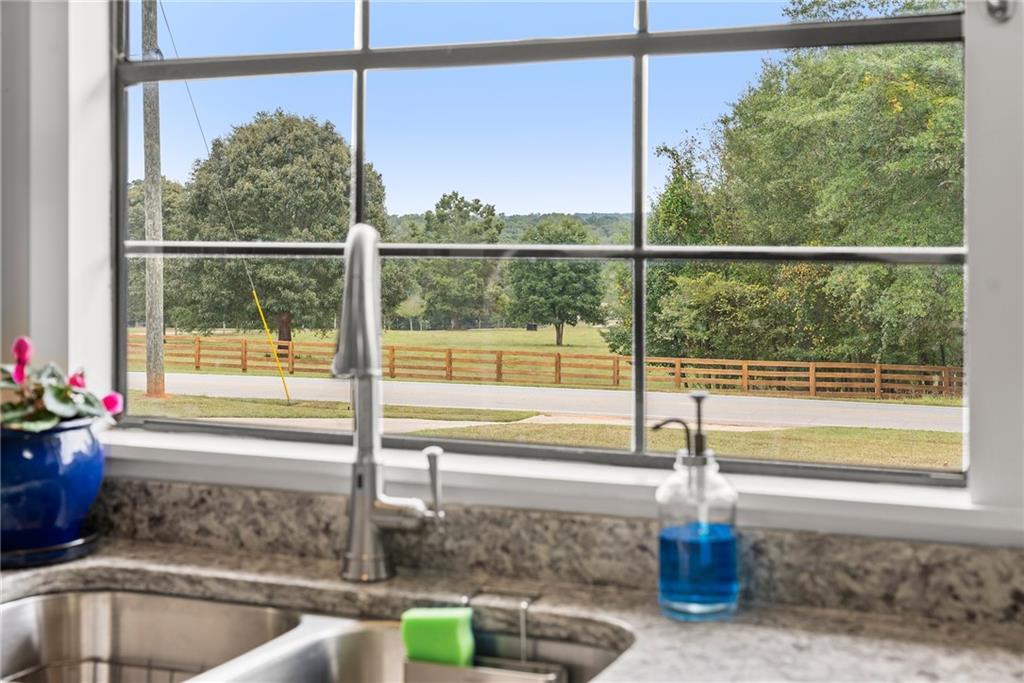1689 Old State Road Pendergrass, GA 30567 - Photo 32 of 58 a view of a window and a table in the kitchen