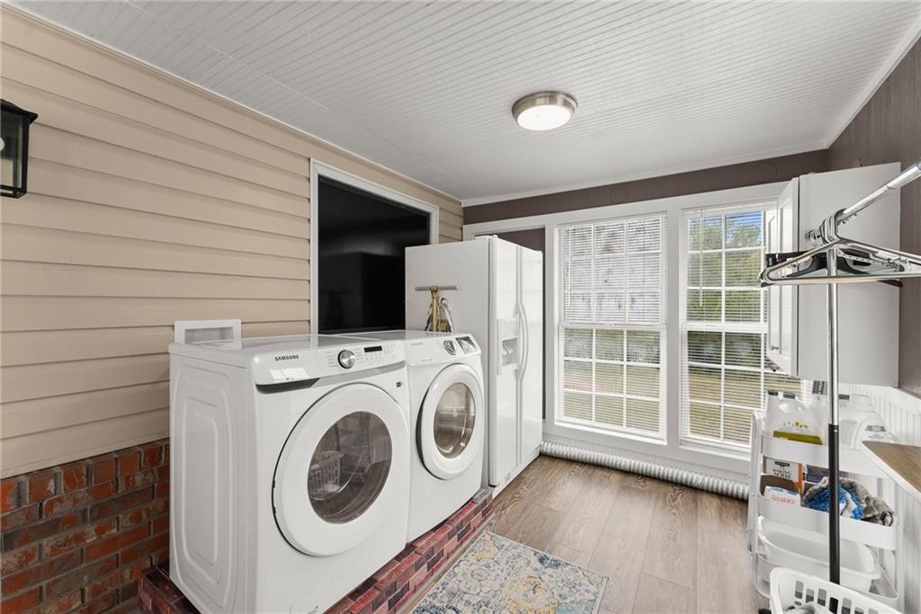1689 Old State Road Pendergrass, GA 30567 - Photo 33 of 58 a utility room with dryer and washer