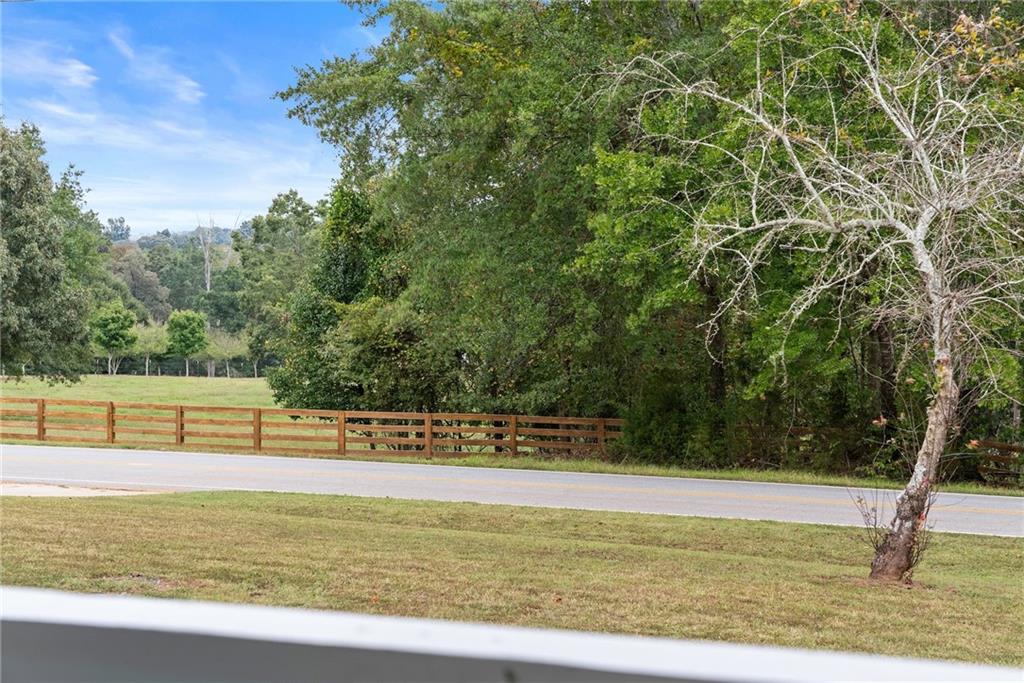 1689 Old State Road Pendergrass, GA 30567 - Photo 45 of 58 a view of a swimming pool with an outdoor seating and a forest