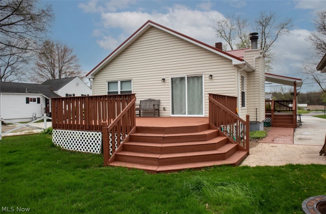 1721 State Road Northwest Warren, OH 44481 - Photo 30 of 37 Rear view of property with a yard and a wooden deck