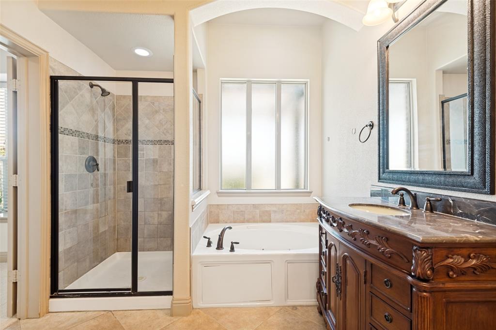 511 Mimosa Trail Forney, TX 75126 - Photo 18 of 30 Oversized shower and you can watch TV while resting in the jetted tub.